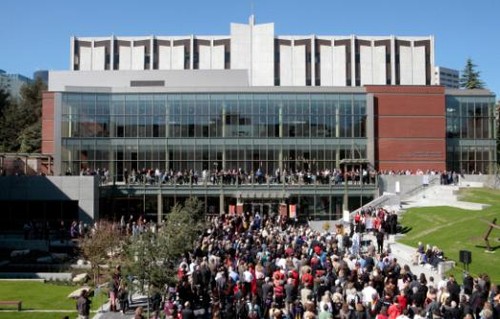 Students and faculty standing outside of  the Lemieux Library
