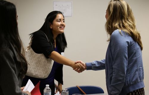 Mentor and Student shaking hands