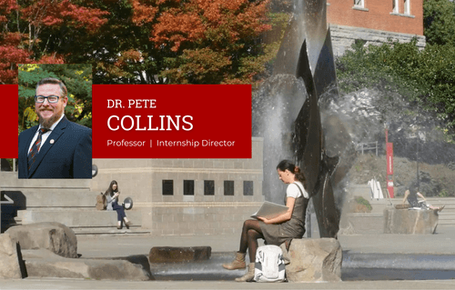 Student studying in front of fountain