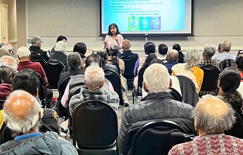 A lecture in a packed room