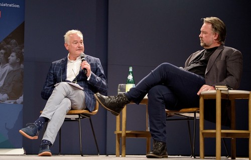 Two speakers on stage for Conversations