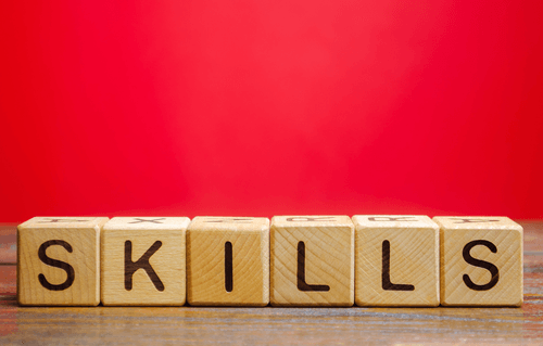 Wood blocks with a letter on each one, spelling out the word ‘skills’