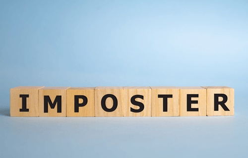 Lettered blocks spelling out 'Imposter'