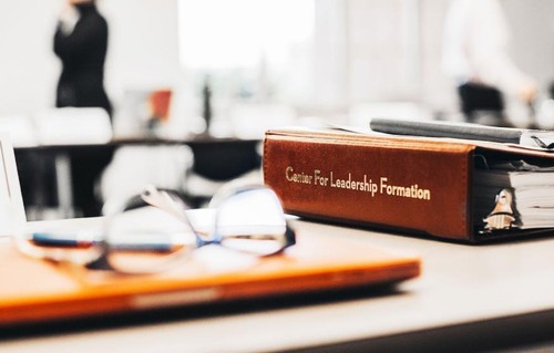 Center for Leadership Formation binder on a table
