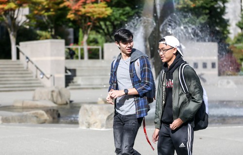 Two Students Walking Through the Quad