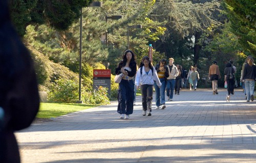Students walking on campus in fall