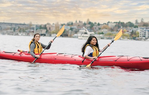 A group of people in a kayak.
