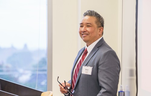 Dean Speaking at a Podium