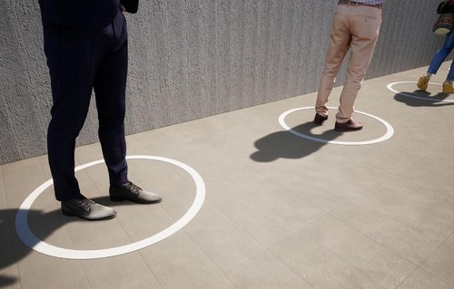 People social distancing in a line