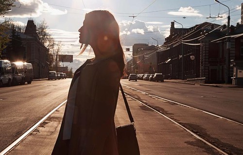 Silhouette of woman on street