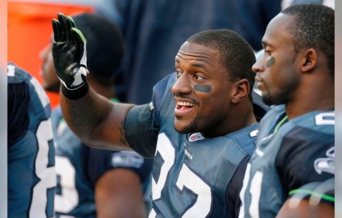 Former Seahawk Jordan Babineaux waving to fans