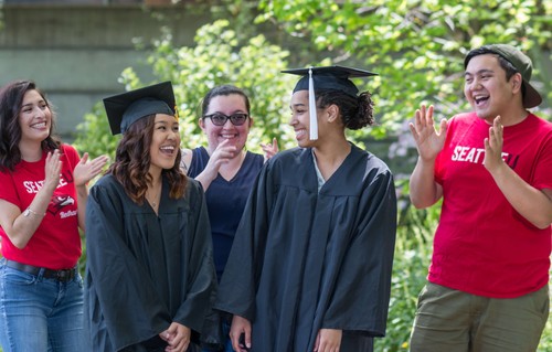 A group of people in graduation gowns.
