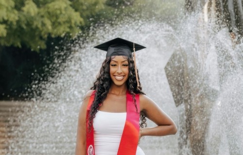 Sport MBA graduate Heyab Daniel in grad cap