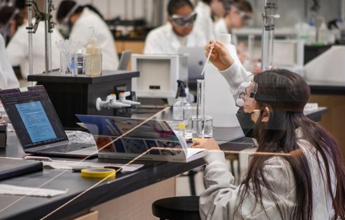 Students conducting research in lab in Sinegal Center.
