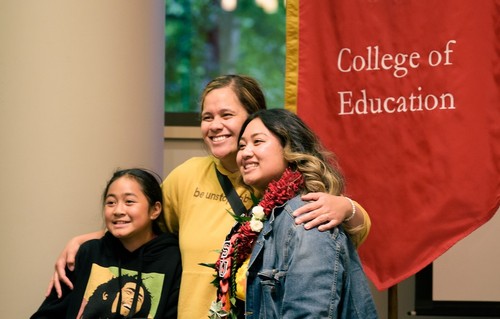 Photo of teacher from COE with a child