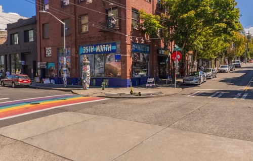A Capitol Hill intersection with a rainbow sidewalk.