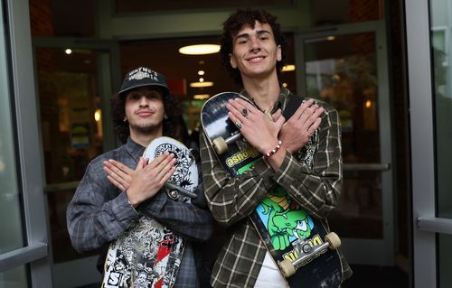 Skateboarders with Hawk hands
