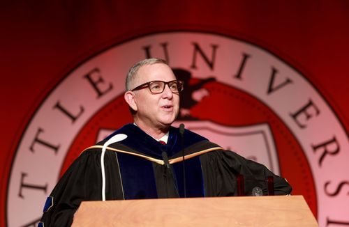 Provost Shane Martin speaking at a podium