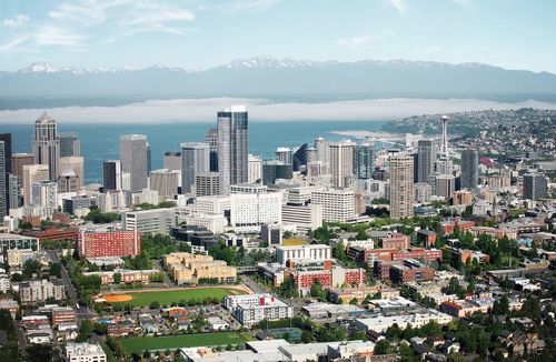 Aerial view includes water and mountains, Seattle University's campus and the city.