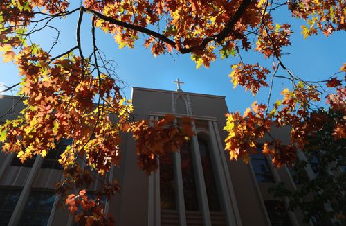 Administration Building behind Fall foliage