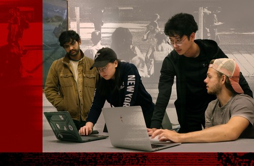 Students looking at computers