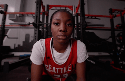 student athlete sitting in a jersey