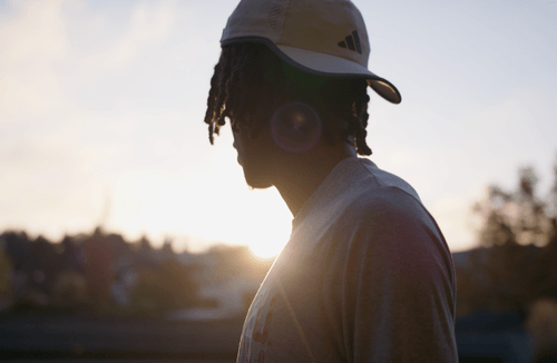 student athlete looking towards the horizon