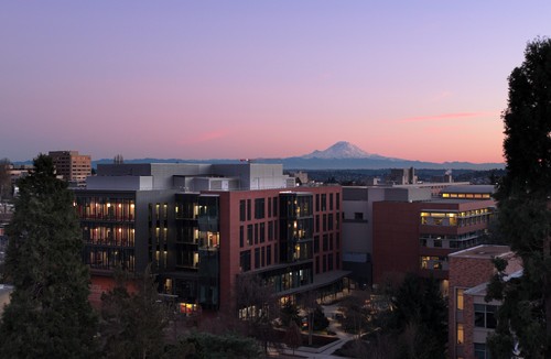 A photograph taken at sunset of Seattle University campus with Mt. Rainer in the background
