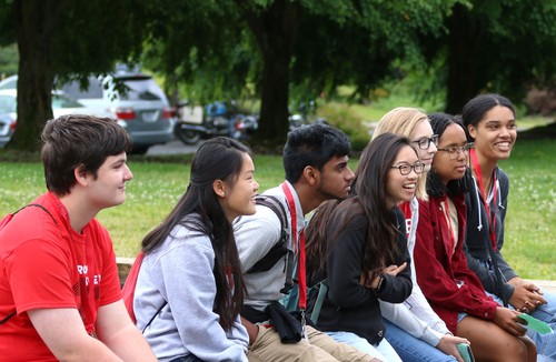 Students sitting on a campus bench