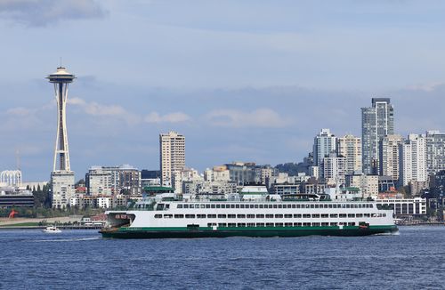 A Washington State Ferry Cruises Past the Space Needle
