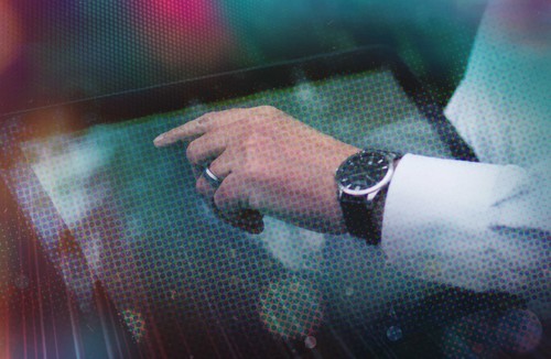 CDLI banner image, man using tablet with colorful distortion effect in background
