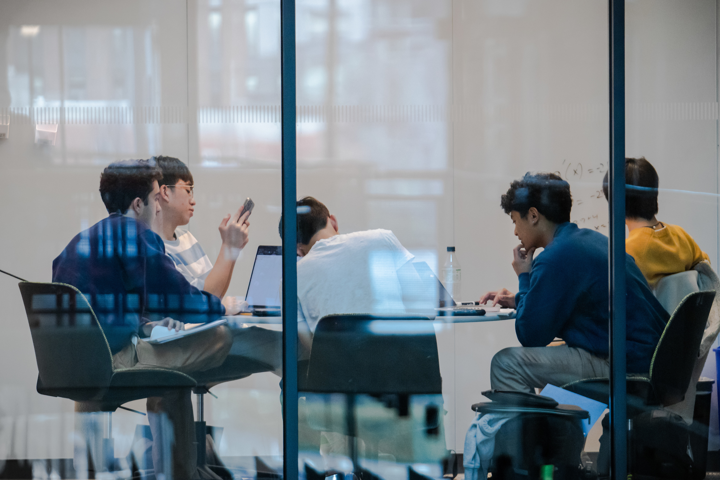 A group of people sitting at a table.